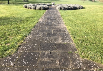 Long pathway patio before it is jet washed 